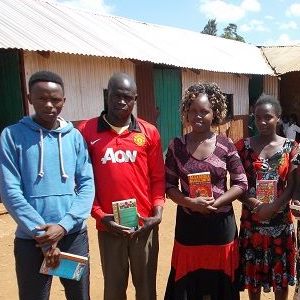 teachers with reading books at Compassion